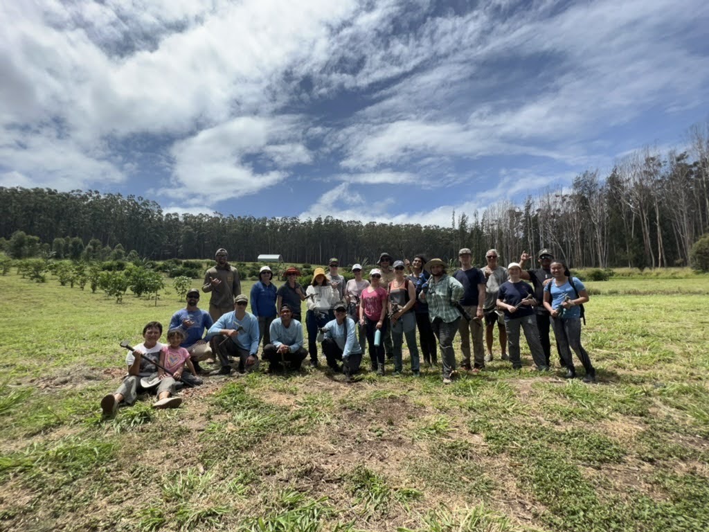 ASB group with gardening tools after working to remove invasive grasses and restore native species to the ‘Aina 